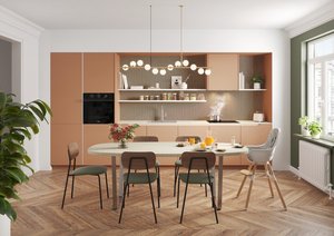 Cocina moderna con muebles color terracota, encimera blanca